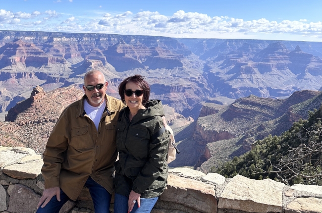 Tracey, a personal travel planner with Pavlus travel and her husband, are shown above the Grand Canyon. Photo by Tracey, courtesy of Pavlus Travel.